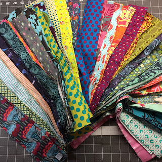 Colorful fanned assortment of patterned fabric swatches