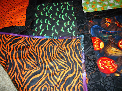 Halloween patchwork quilt with pumpkins