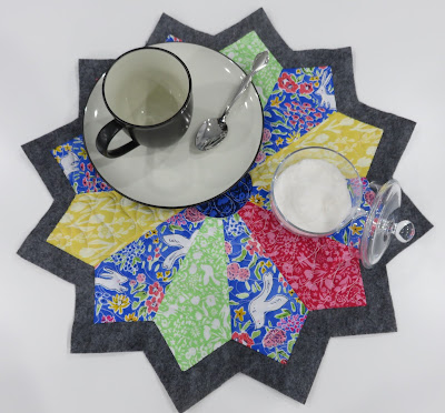 Teacup and sugar bowl on star patchwork mat