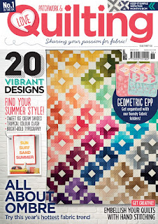 Love Quilting magazine cover with colorful quilt
