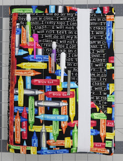 Crayon-patterned pencil pouch with repeating text