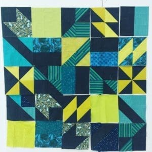 A quilt with many different colors of fabric.