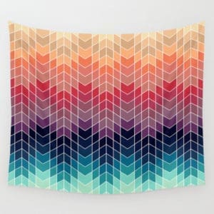 A colorful wall hanging with an abstract design.