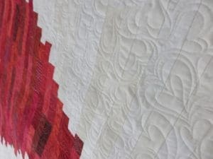 A close up of the quilting on a quilt