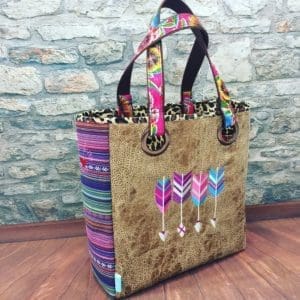 A bag with arrows and leopard print on it.