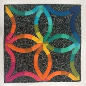 A picture of a quilt with the same pattern as it.