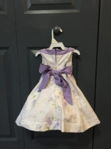 A dress hanging on the wall