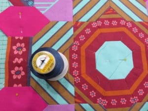 A spool of thread and some fabric on the floor