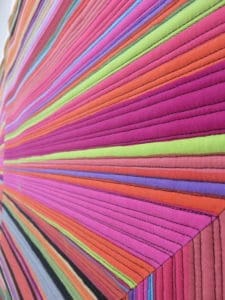 A close up of many different colored papers