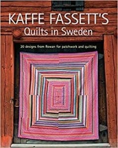 A book cover with a picture of a quilt.