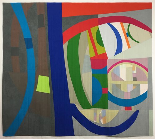 A painting of various colors and shapes on the wall.