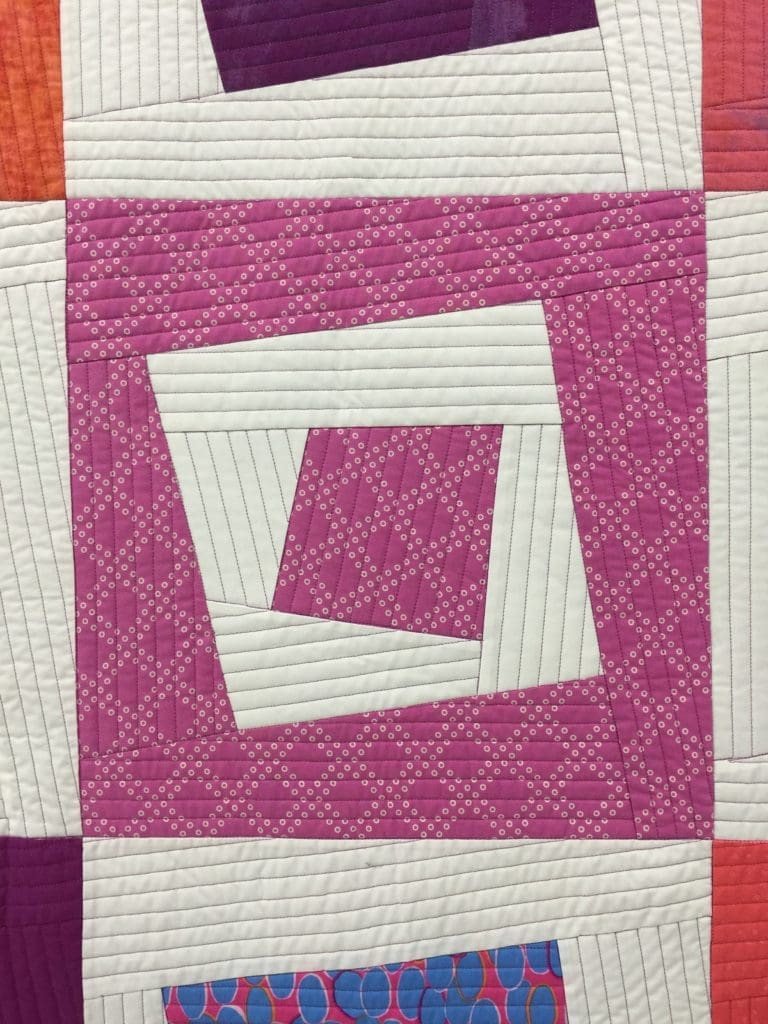 A close up of the square quilt pattern