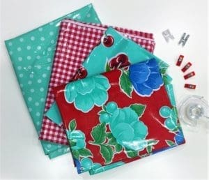 A table with some fabric and some clips