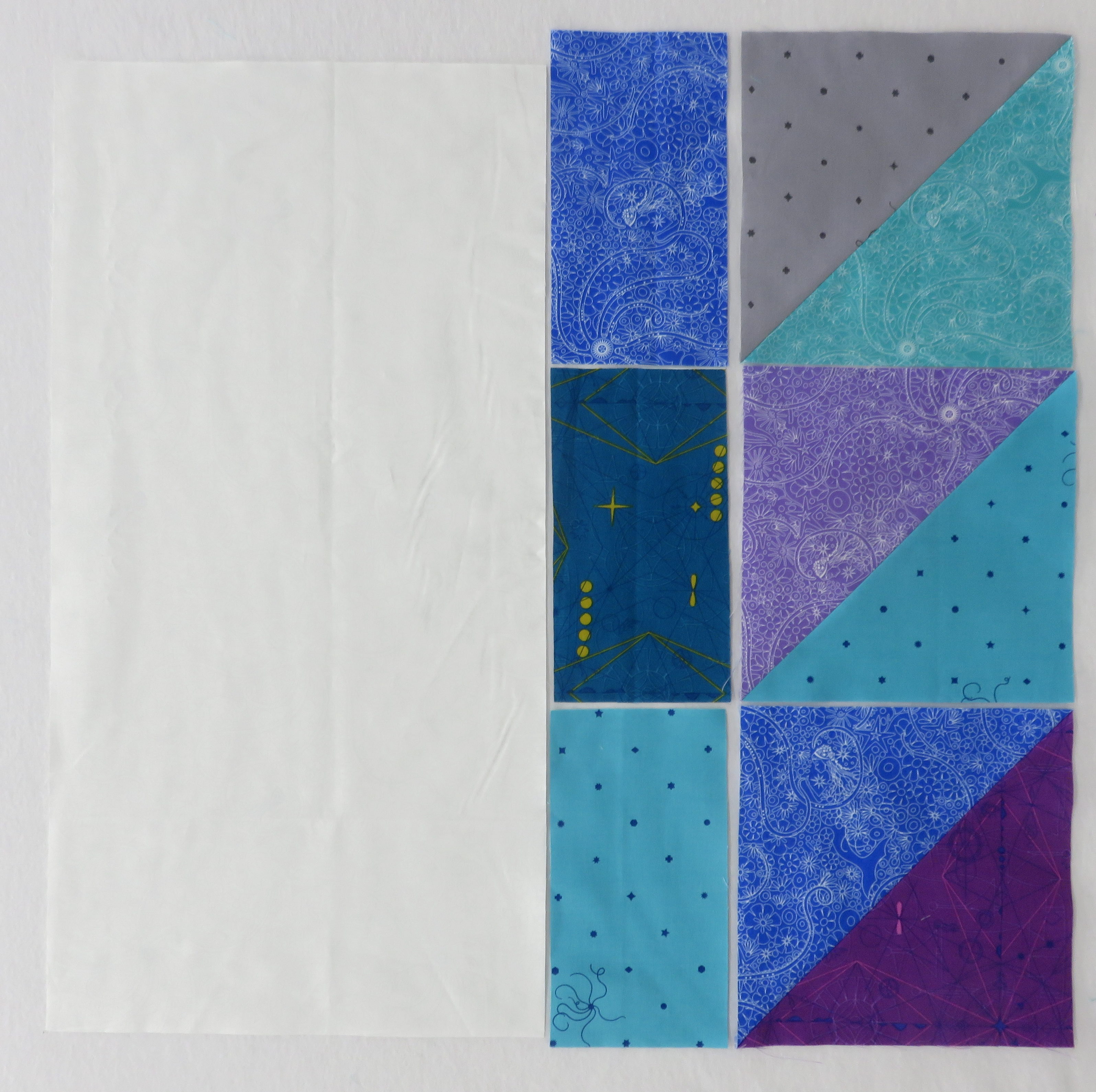 A white machine with some blue and white paper