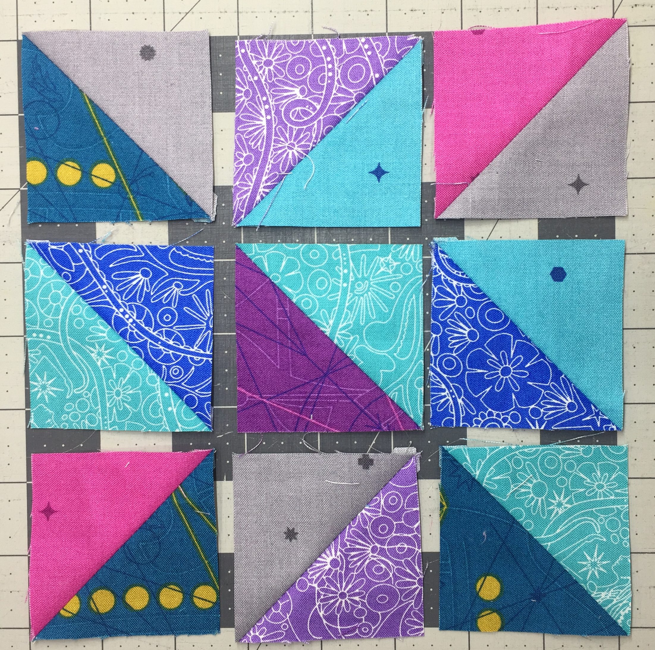 A blue and white pattern with triangles on it.