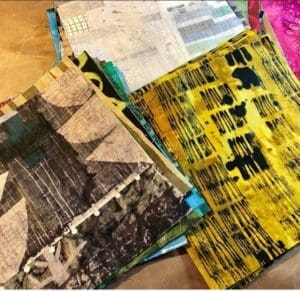 A table with several different colored papers on it.