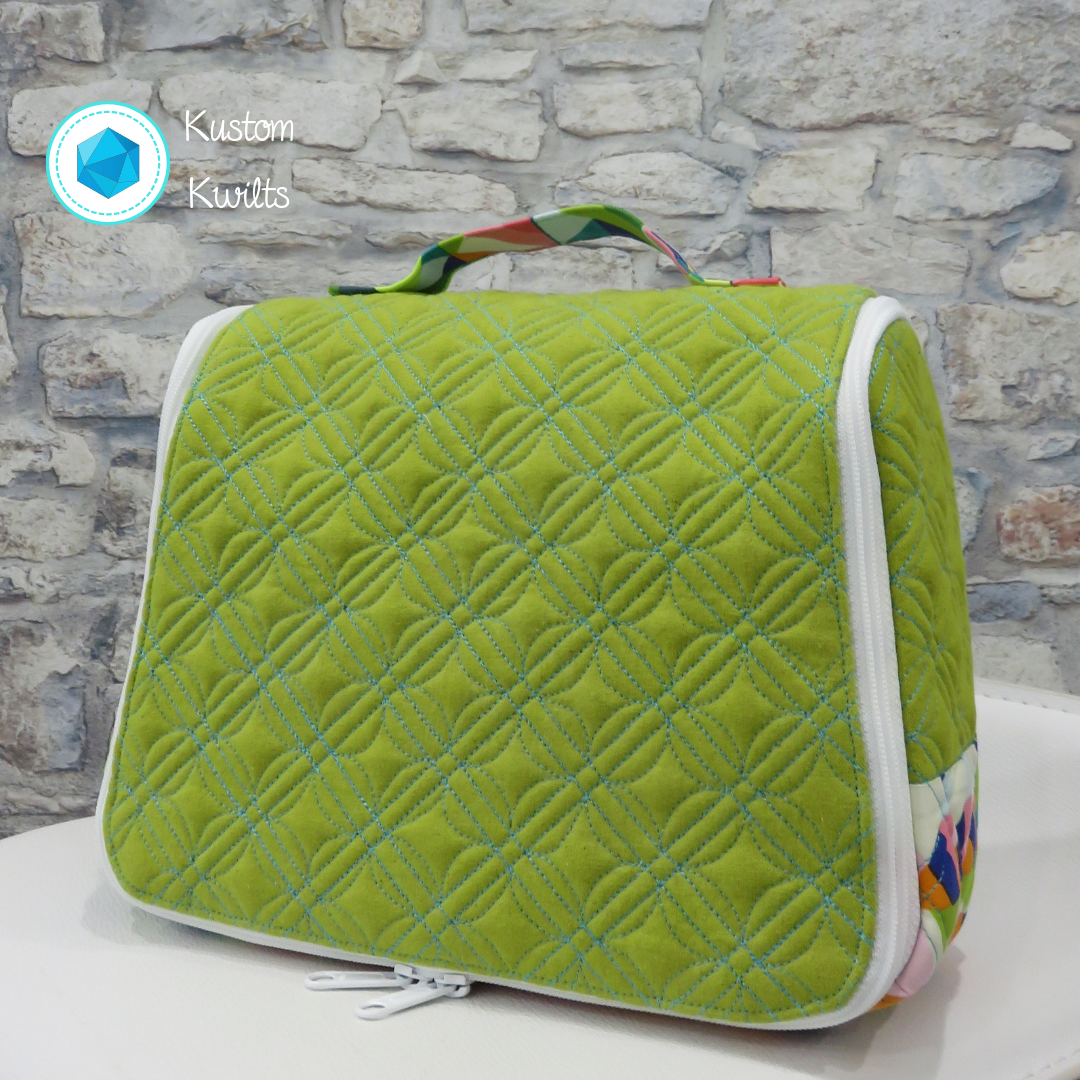A green bag sitting on top of a table.