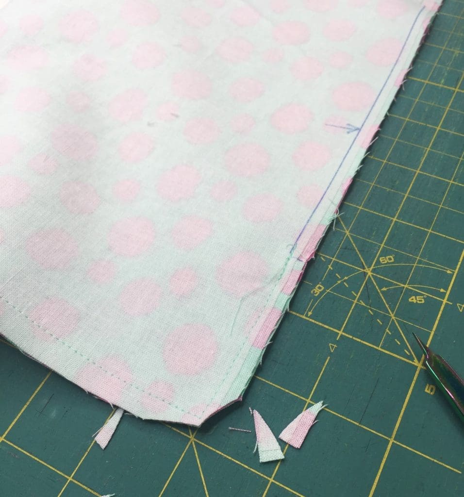 A pink and blue heart on top of black and white stripes.