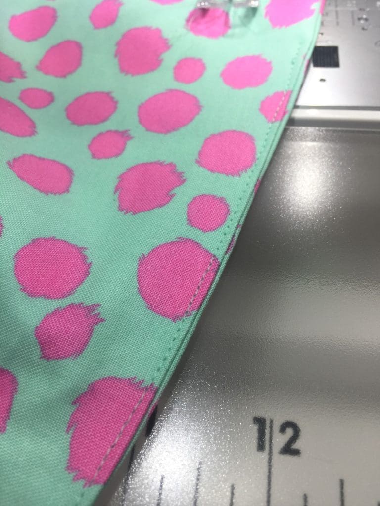 A pink and blue heart on top of black and white stripes.