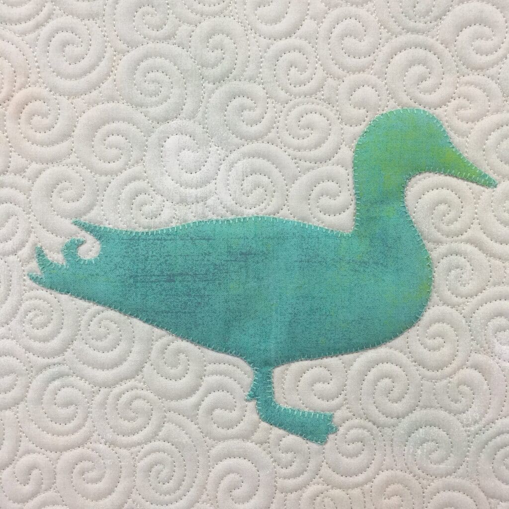 A duck sitting on top of a white paper towel.