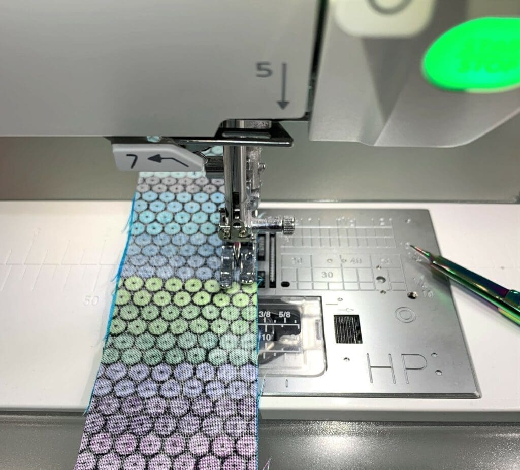 A sewing machine with a spool of thread on it.