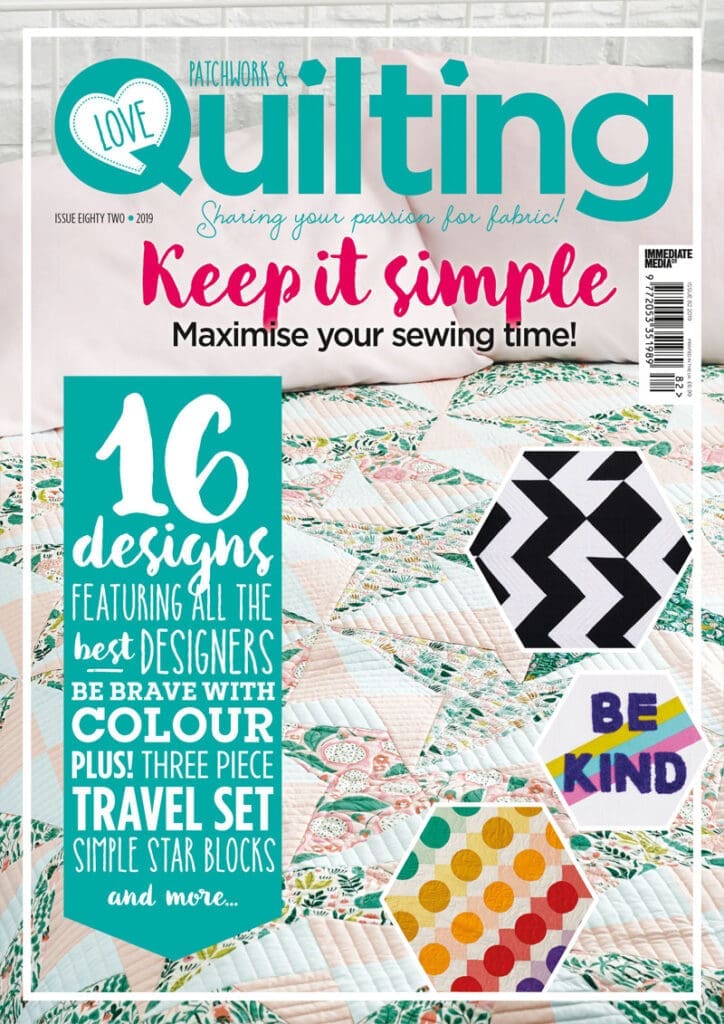 A magazine cover with a quilt on it.