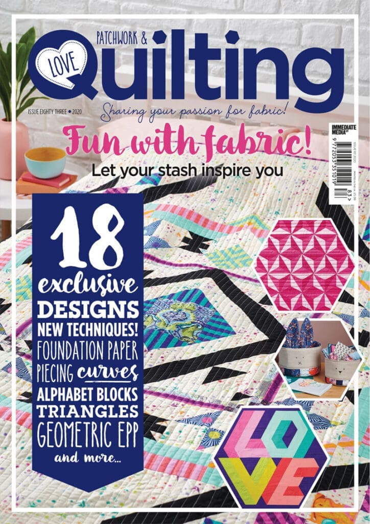 A magazine cover with a quilt on it.
