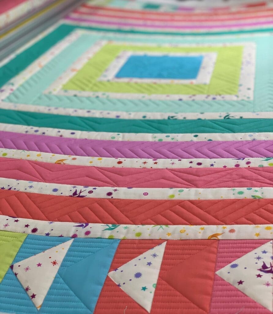 Close-up of colorful geometric patchwork quilt