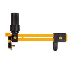 A yellow and black tool is attached to the side of a wall.