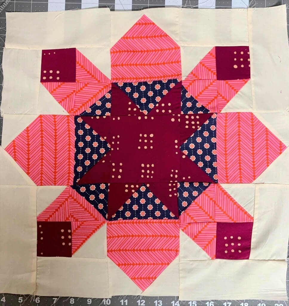 A quilt block with a star in the center.