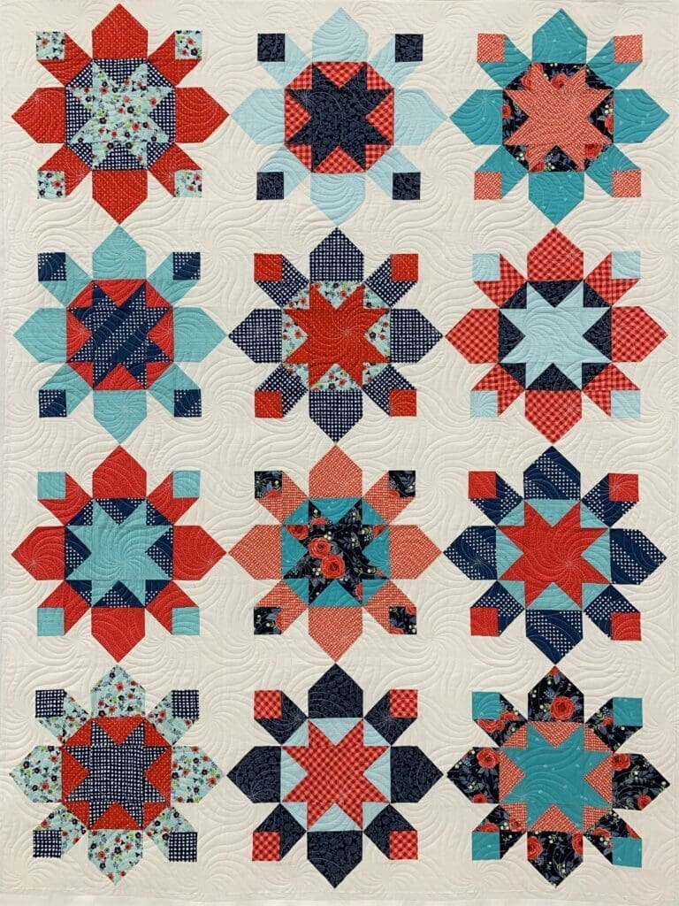 A quilt with nine different designs of stars.