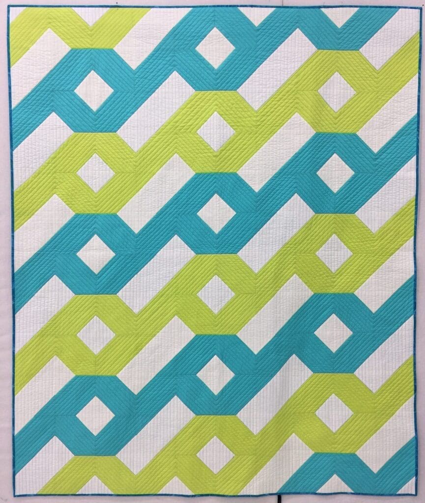 A close up of some fabric swatches on top of a table