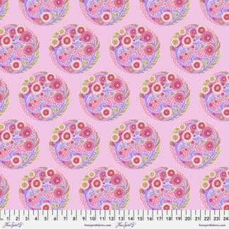 A pink background with many different colored flowers.