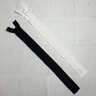 A pair of zippers are laying on the floor.