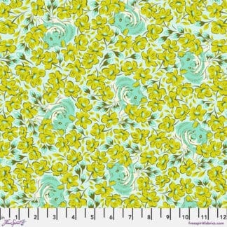 A green and yellow floral pattern on fabric.