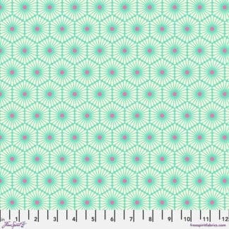 A green and pink pattern is on the ground.