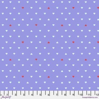 A purple background with white and red polka dots.