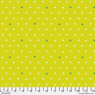 A yellow polka dot fabric with white and green dots.