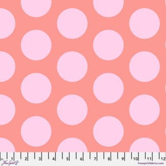 A pink polka dot fabric with white dots.