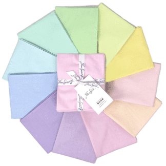 A bundle of pastel colored fabric swatches.