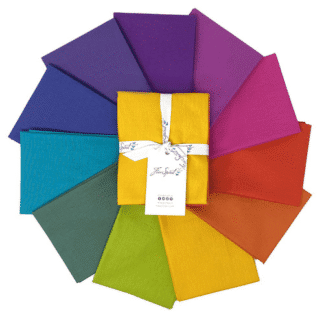 A set of twelve different colors of fabric.
